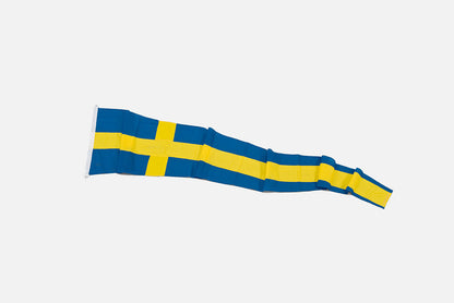 Svensk korsvimpel i färgen blå och gul som ligger utvecklad